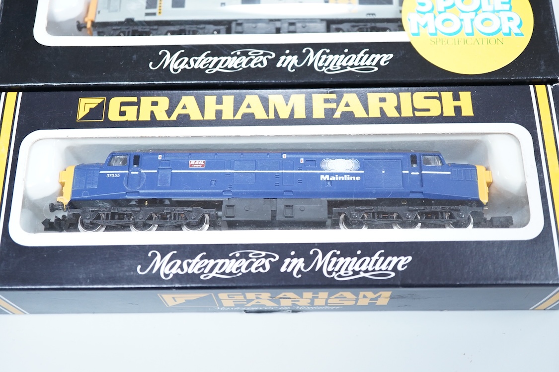 Four boxed Graham Farish N gauge railway Class 37 diesel locomotives; a BR Railfreight, 37 699 (8036), a BR Petroleum Sector, 37 887 (8037), a Mainline, 37055 (803D) and an EWS, 37408 (803E).
